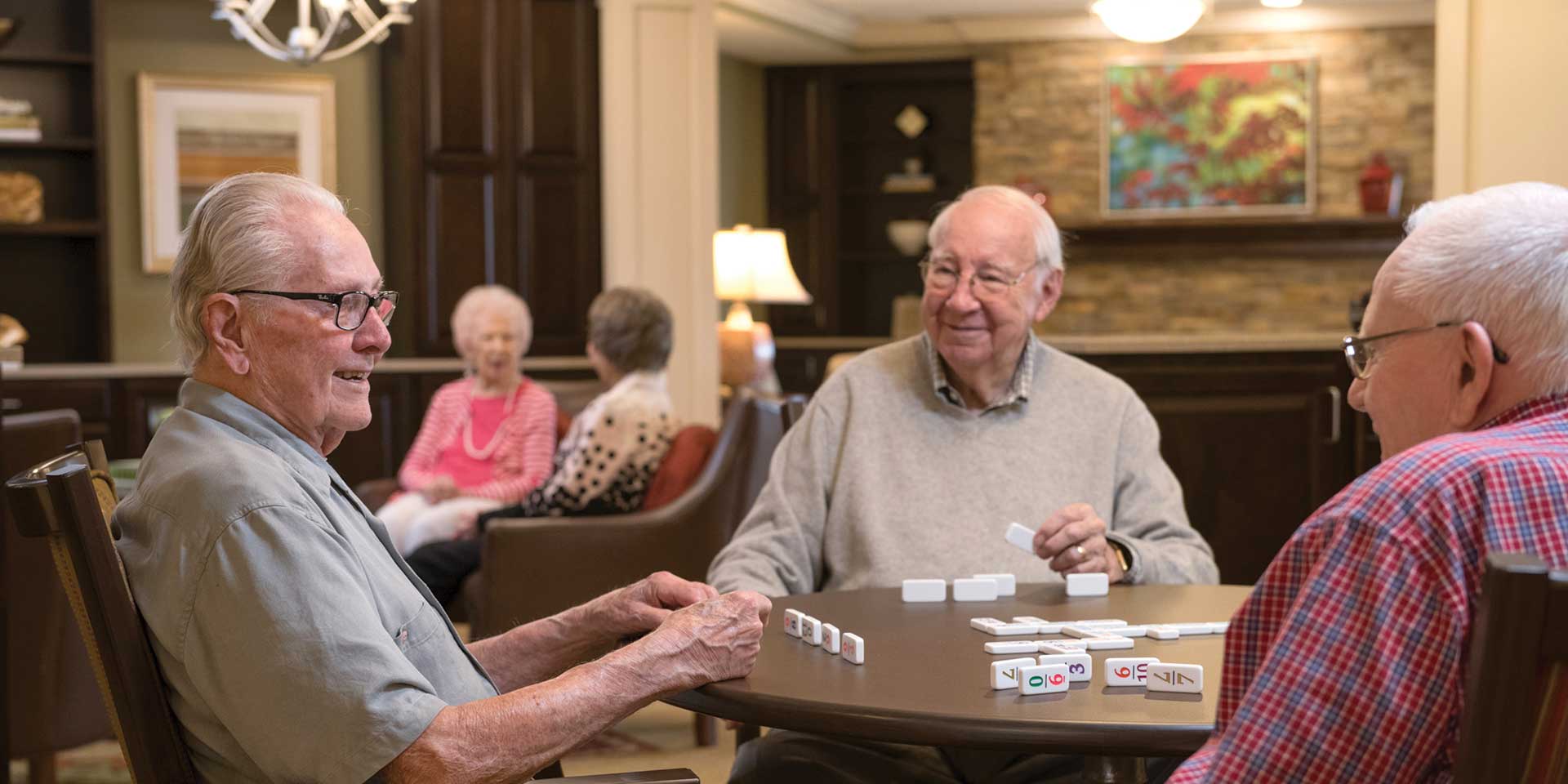 Retired men playing dominos