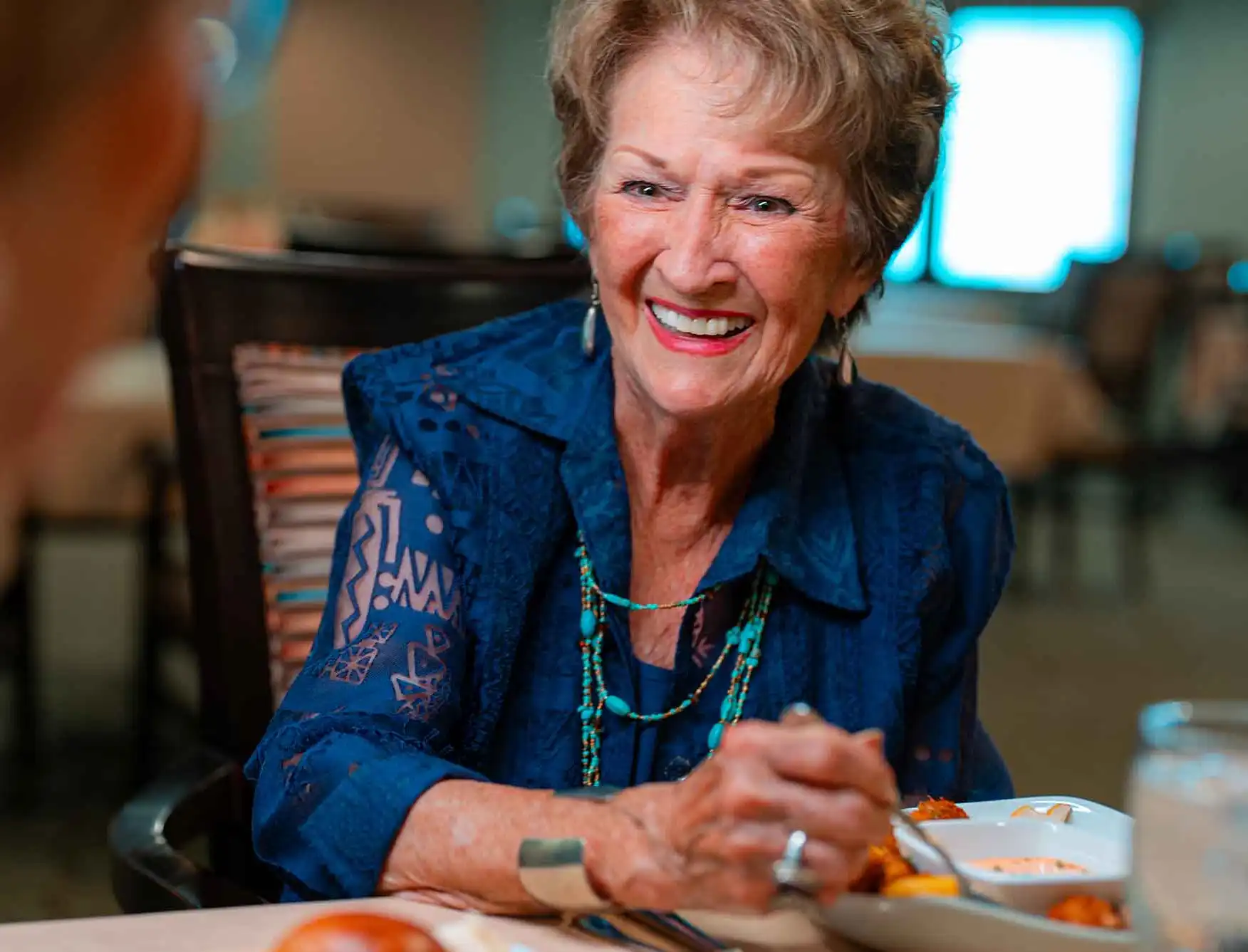 Woman dining with friends