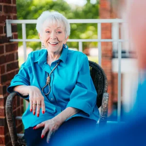 Woman sitting on her porch