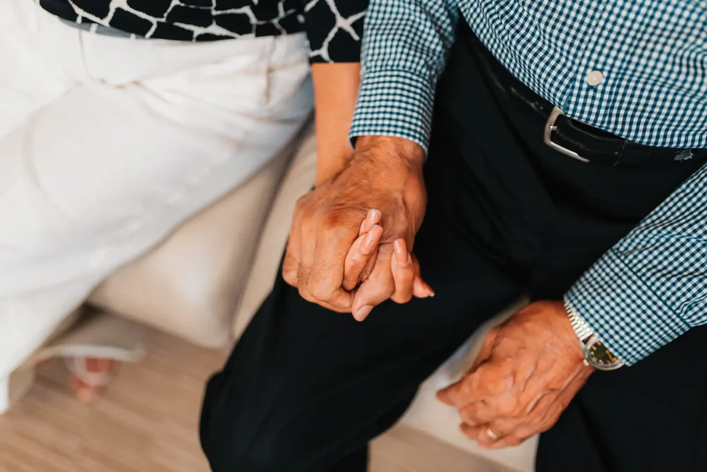 Couple holding hands