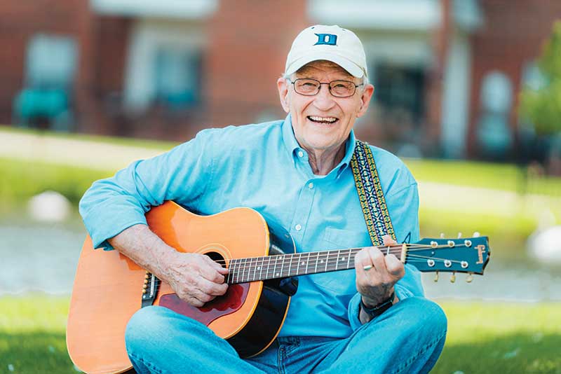 Epworth resident playing the guitar