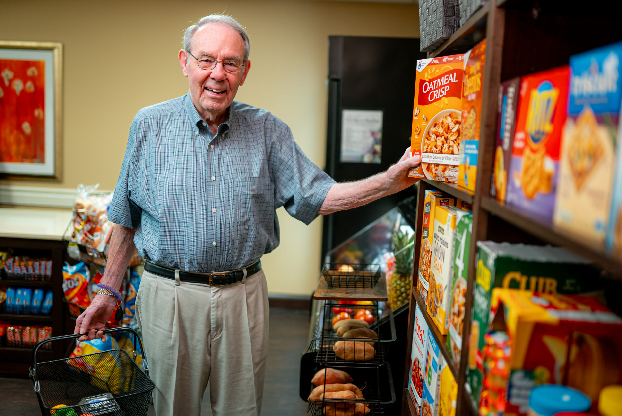 Senior buying food at the market in Epworth Villa